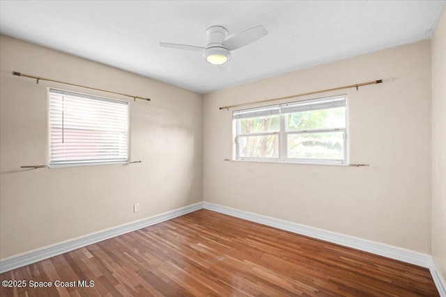 417 E Grant St, Orlando, FL 32806 - unfurnished room featuring wood finished floors, baseboards, and ceiling fan