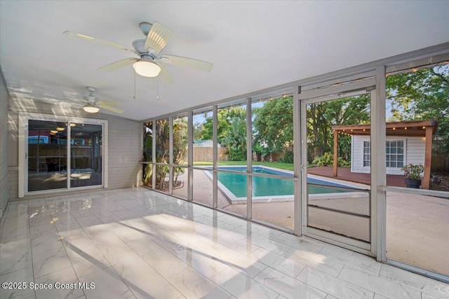 417 E Grant St, Orlando, FL 32806 - unfurnished sunroom with a ceiling fan and plenty of natural light