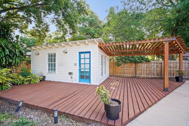 417 E Grant St, Orlando, FL 32806 - wooden deck featuring a pergola, a fenced backyard, and an outbuilding