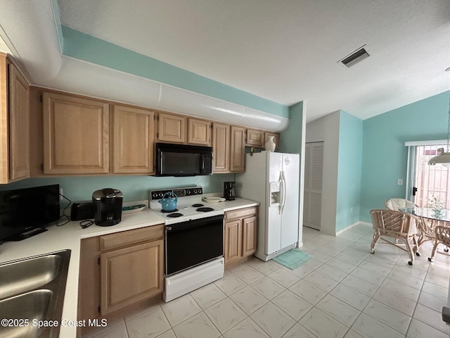 kitchen with a sink, white appliances, light countertops, lofted ceiling, and visible vents