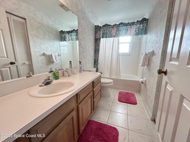 bathroom with wallpapered walls, visible vents, toilet, vanity, and shower / tub combo with curtain