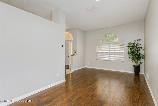 7016 Hammock Trace Dr, Melbourne, FL 32940 - spare room featuring wood finished floors and baseboards