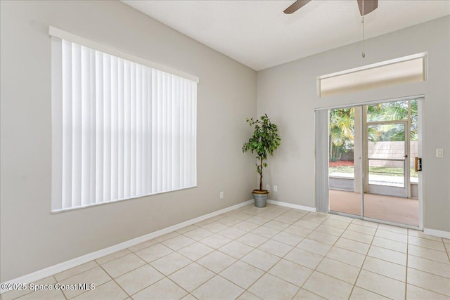 7016 Hammock Trace Dr, Melbourne, FL 32940 - empty room featuring a ceiling fan, baseboards, and light tile patterned flooring