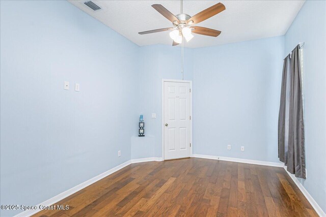 7016 Hammock Trace Dr, Melbourne, FL 32940 - empty room with ceiling fan, dark wood finished floors, and baseboards