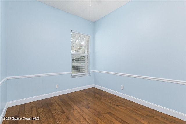7016 Hammock Trace Dr, Melbourne, FL 32940 - unfurnished room featuring baseboards and dark wood-style flooring