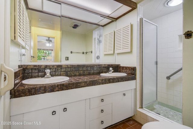 1501 Oranole Rd, Maitland, FL 32751 - bathroom with tiled shower, double vanity, tile patterned floors, and a ceiling fan