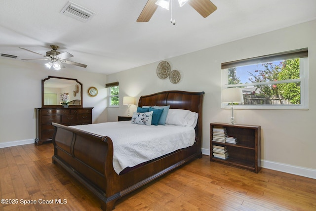 1501 Oranole Rd, Maitland, FL 32751 - bedroom with hardwood / wood-style floors, baseboards, and a ceiling fan