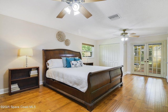 1501 Oranole Rd, Maitland, FL 32751 - bedroom featuring french doors, access to exterior, a closet, wood finished floors, and baseboards