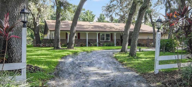 1501 Oranole Rd, Maitland, FL 32751 - single story home with brick siding and a front yard