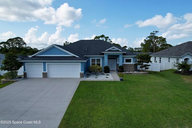 6910 Hundred Acre Dr, Cocoa, FL 32927 - view of front of house featuring fence, a front lawn, stone siding, a garage, and driveway