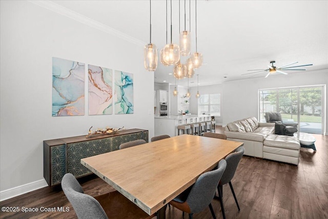6910 Hundred Acre Dr, Cocoa, FL 32927 - dining area with crown molding, a ceiling fan, baseboards, and dark wood-style floors