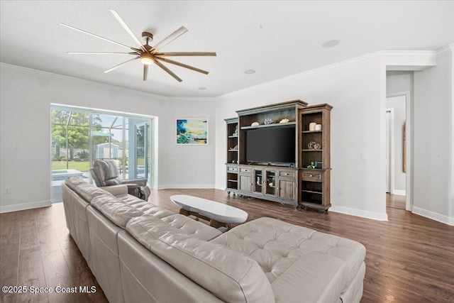 6910 Hundred Acre Dr, Cocoa, FL 32927 - living room featuring baseboards, ornamental molding, a ceiling fan, and dark wood-style flooring