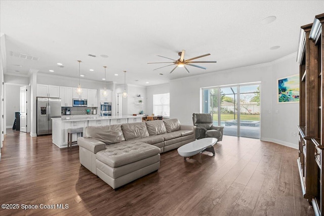 6910 Hundred Acre Dr, Cocoa, FL 32927 - living room featuring baseboards, ceiling fan, visible vents, and dark wood-type flooring