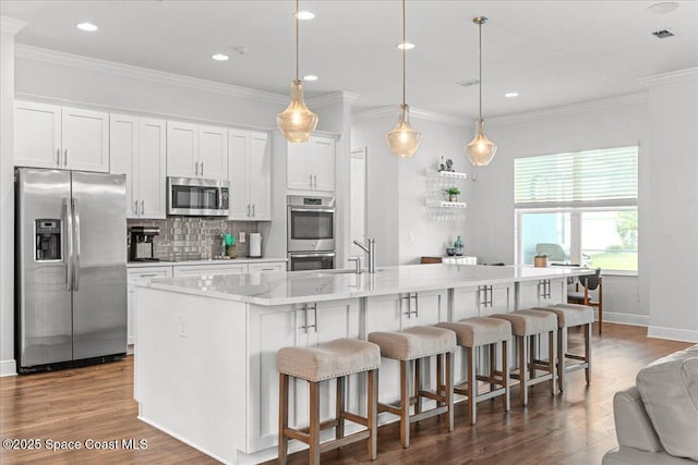 6910 Hundred Acre Dr, Cocoa, FL 32927 - kitchen with a sink, white cabinetry, backsplash, and stainless steel appliances