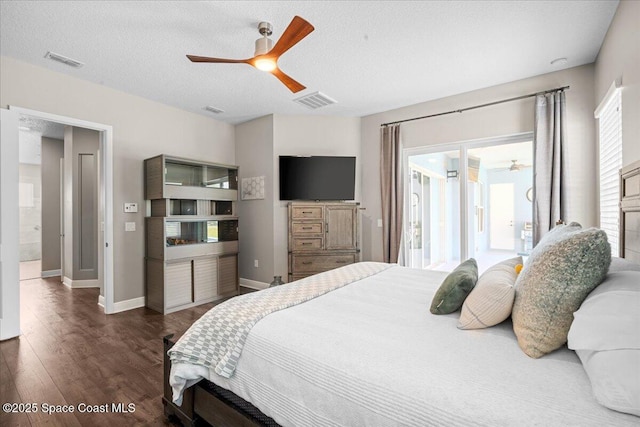 6910 Hundred Acre Dr, Cocoa, FL 32927 - bedroom with visible vents, a ceiling fan, baseboards, and dark wood-style floors