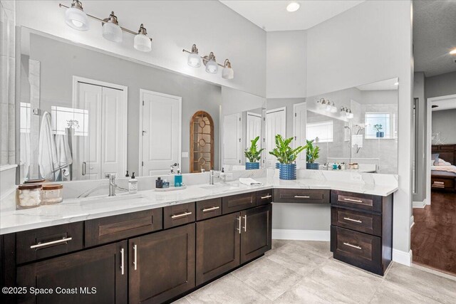 6910 Hundred Acre Dr, Cocoa, FL 32927 - bathroom featuring tile patterned floors, baseboards, and vanity