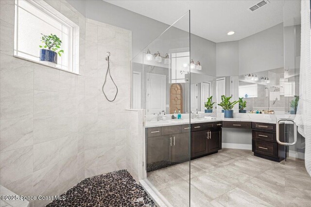 6910 Hundred Acre Dr, Cocoa, FL 32927 - bathroom with a walk in shower, visible vents, and vanity