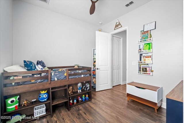 6910 Hundred Acre Dr, Cocoa, FL 32927 - bedroom featuring visible vents, a ceiling fan, baseboards, and wood finished floors