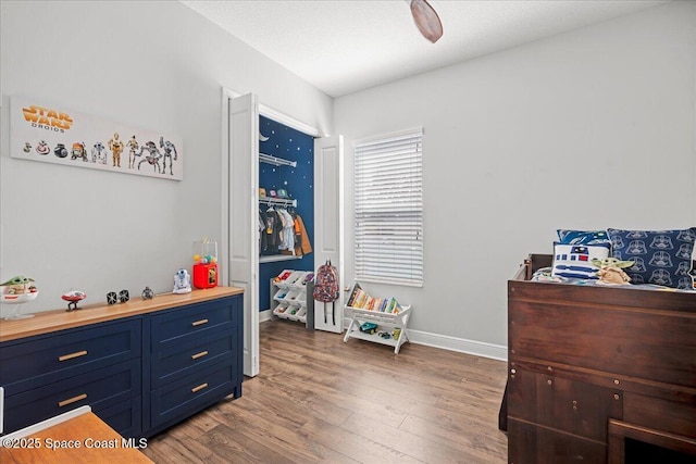 6910 Hundred Acre Dr, Cocoa, FL 32927 - bedroom featuring baseboards and wood finished floors