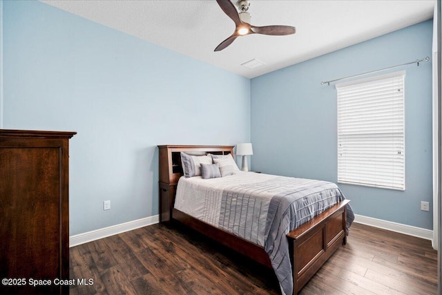 6910 Hundred Acre Dr, Cocoa, FL 32927 - bedroom with baseboards, ceiling fan, and wood finished floors