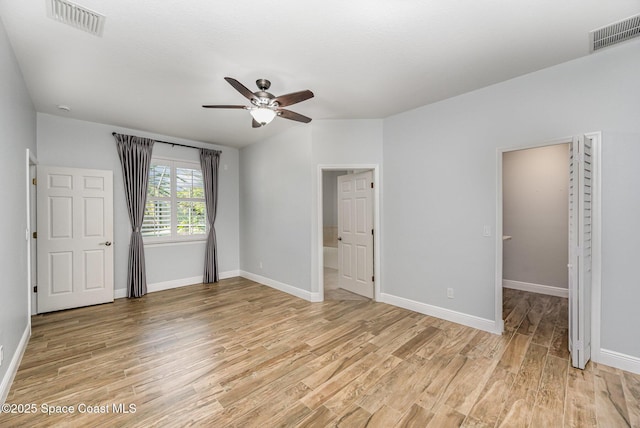 1534 Knoll Ridge Dr, Melbourne, FL 32940 - unfurnished bedroom with light wood finished floors, baseboards, and visible vents