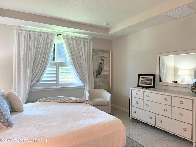 bedroom featuring baseboards, visible vents, a textured ceiling, and marble finish floor