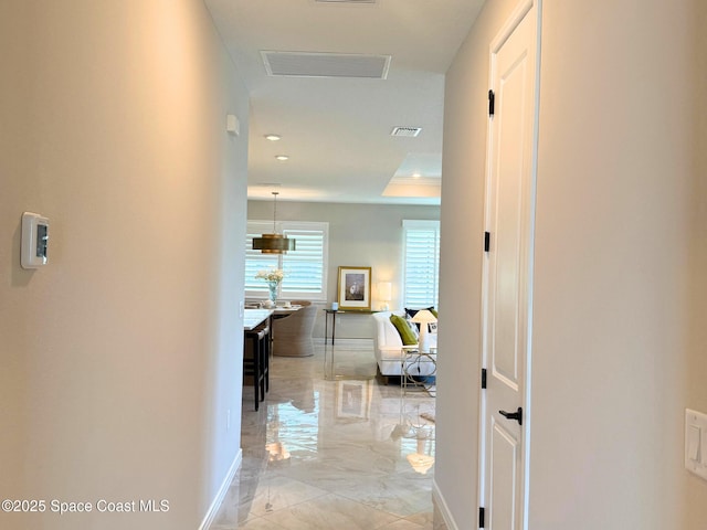hall with marble finish floor, baseboards, visible vents, and recessed lighting