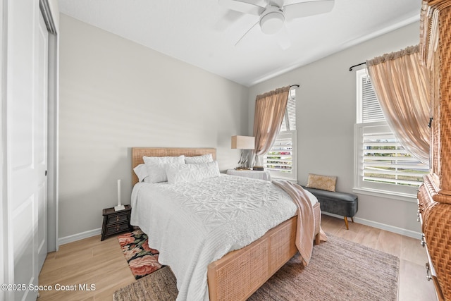 8811 Stormy Sky Ct, Melbourne, FL 32940 - bedroom with light wood finished floors, baseboards, a closet, and a ceiling fan