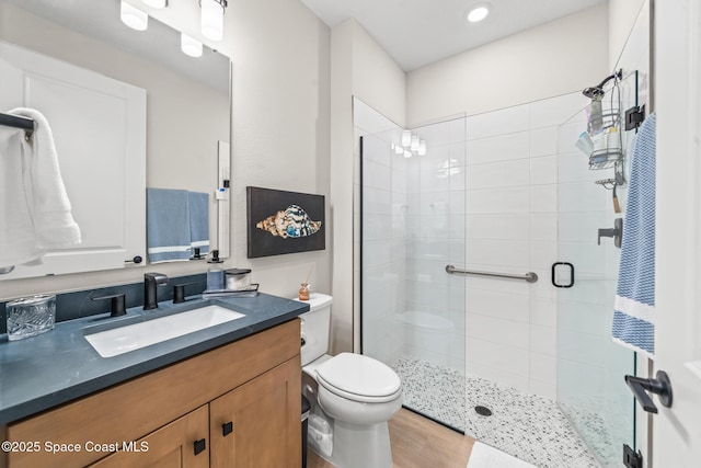 8811 Stormy Sky Ct, Melbourne, FL 32940 - full bathroom with a stall shower, toilet, vanity, and wood finished floors