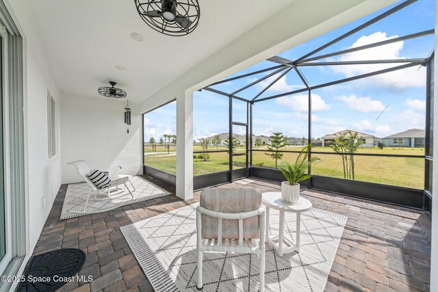 8811 Stormy Sky Ct, Melbourne, FL 32940 - sunroom / solarium with a residential view