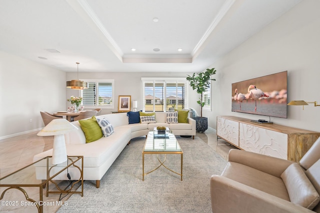 8811 Stormy Sky Ct, Melbourne, FL 32940 - living room featuring ornamental molding, a tray ceiling, baseboards, and recessed lighting