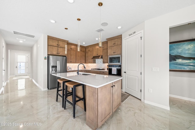 8811 Stormy Sky Ct, Melbourne, FL 32940 - kitchen with appliances with stainless steel finishes, a sink, light marble finish flooring, backsplash, and brown cabinets