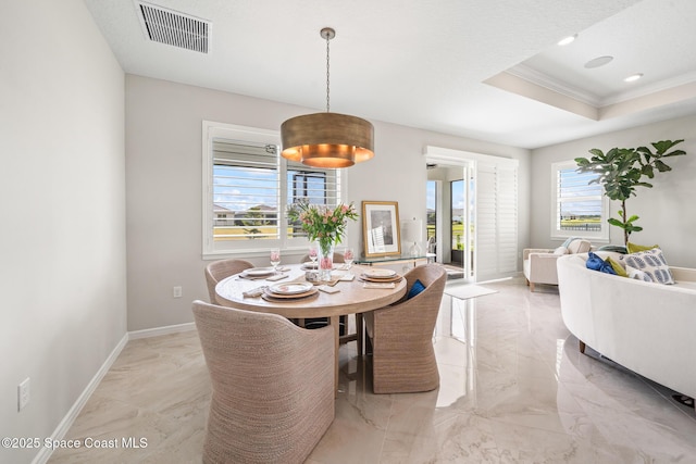 8811 Stormy Sky Ct, Melbourne, FL 32940 - dining space with light marble finish flooring, baseboards, and ornamental molding