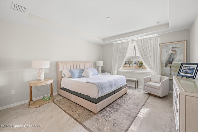 8811 Stormy Sky Ct, Melbourne, FL 32940 - bedroom featuring a raised ceiling, baseboards, and light marble finish floors