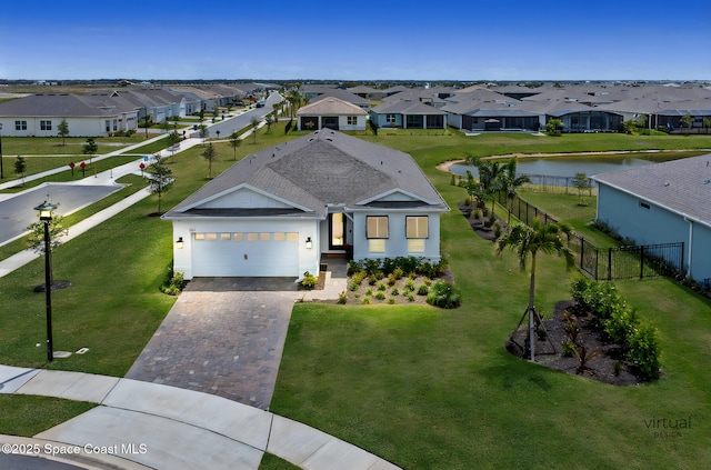 8811 Stormy Sky Ct, Melbourne, FL 32940 - ranch-style house featuring a residential view, driveway, a garage, and a water view