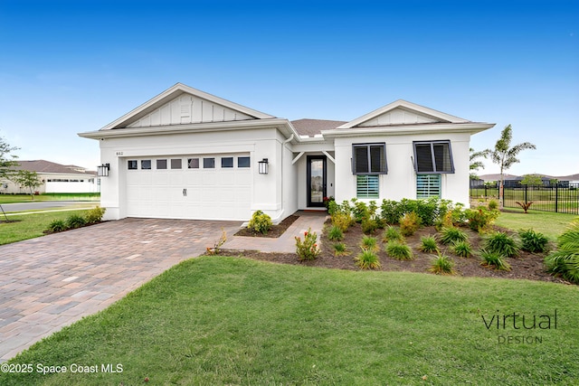 8811 Stormy Sky Ct, Melbourne, FL 32940 - view of front facade with decorative driveway, an attached garage, board and batten siding, and stucco siding