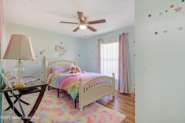 bedroom with wood finished floors and ceiling fan