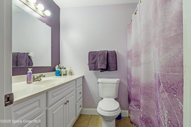 bathroom featuring tile patterned floors, toilet, vanity, baseboards, and a shower with shower curtain