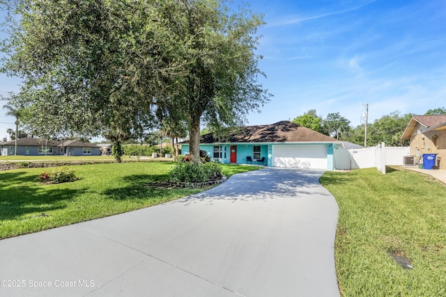 ranch-style house featuring central AC, concrete driveway, an attached garage, fence, and a front yard