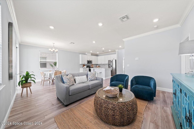 912 Covington Ct, Rockledge, FL 32955 - living room with baseboards, visible vents, light wood-style floors, a chandelier, and crown molding