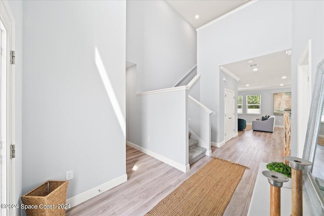 912 Covington Ct, Rockledge, FL 32955 - entryway featuring wood finished floors, ornamental molding, baseboards, and stairway