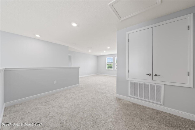 912 Covington Ct, Rockledge, FL 32955 - carpeted empty room featuring recessed lighting, visible vents, baseboards, and attic access