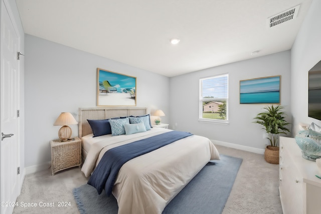 912 Covington Ct, Rockledge, FL 32955 - bedroom with visible vents, baseboards, and light carpet