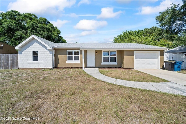 ranch-style home with a garage, concrete driveway, and stucco siding
