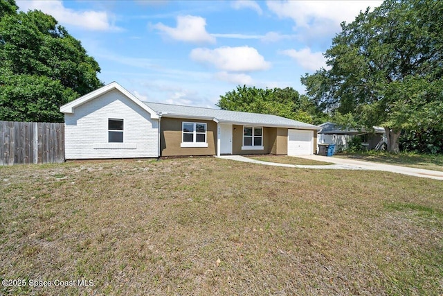 ranch-style home featuring an attached garage and driveway