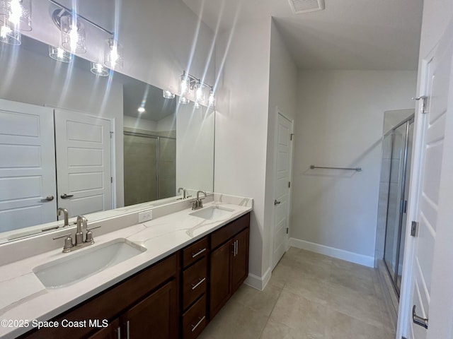 1208 Soleway Ave NW, Palm Bay, FL 32907 - bathroom featuring a shower stall, double vanity, and tile patterned floors