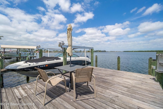 630 Paula Ave, Merritt Island, FL 32953 - dock with a water view and boat lift