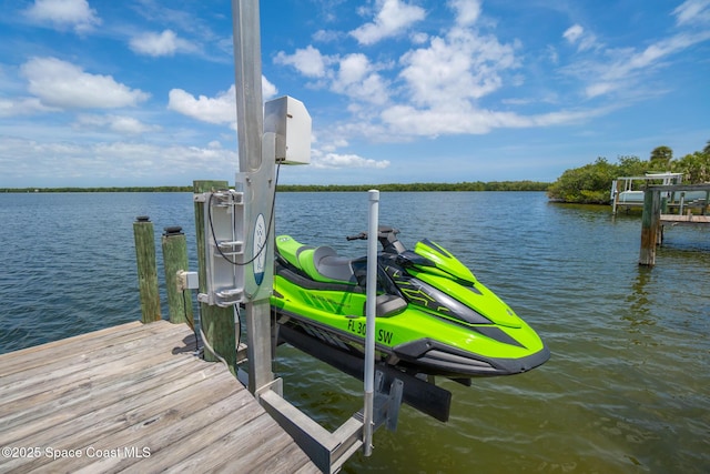 630 Paula Ave, Merritt Island, FL 32953 - dock featuring boat lift and a water view