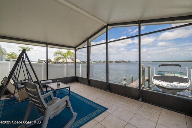 630 Paula Ave, Merritt Island, FL 32953 - sunroom / solarium featuring vaulted ceiling, a water view, tile patterned flooring, and plenty of natural light