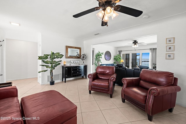 630 Paula Ave, Merritt Island, FL 32953 - living room with a ceiling fan and light tile patterned floors